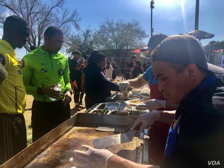 Soccer players wait for tacos at a Latino soccer tournament sponsored by Senator Bernie Sanders. (Carolyn Presutti/VOA)