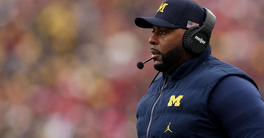 Prosecutors claim ex-University of Michigan football coach threatened suicide during home invasion