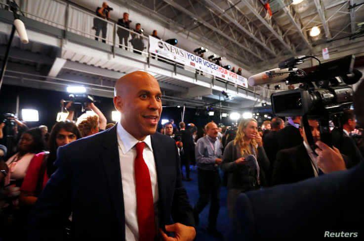 Senator Cory Booker works his way through the spin room after the 2020 Democratic U.S. presidential debate in Houston, Texas, U.S. September 12, 2019. REUTERS/Jonathan Bachman