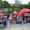 Fans, Protesters Line Up for Trump’s Re-election Rally