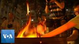 Hong Kong Protesters Burn Joss Paper Outside Police Building