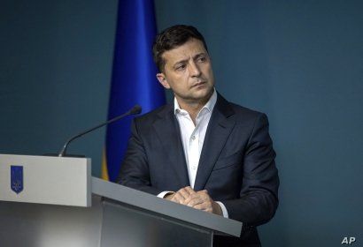 FILE - Ukrainian President Volodymyr Zelenskiy speaks during a meeting with law enforcement officers in Kyiv, Ukraine, July 23, 2019. 