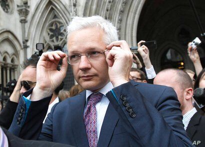 WikiLeaks founder Julian Assange leaves the High Court in London, England, July 13, 2011. (Reuters)