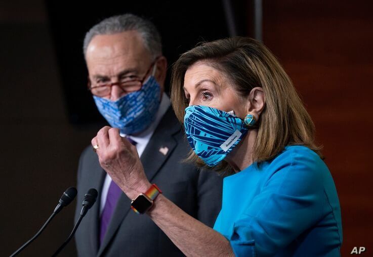 Speaker of the House Nancy Pelosi, D-Calif., and Senate Minority Leader Chuck Schumer, D-N.Y., left, meet with reporters.