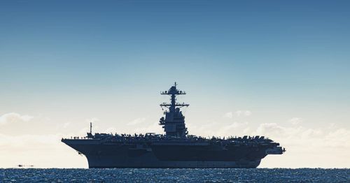 U.S. Navy helicopter and fighter jet crash in South China Sea, crew safe