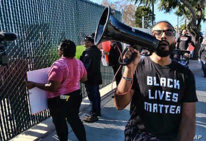 Protestors with Black Lives Matter protest a visit by Democratic presidential candidate and former South Bend, Ind., Mayor Pete…