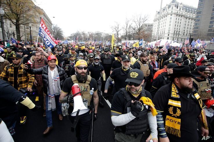 Supporters of President Donald Trump who are wearing attire associated with the Proud Boys attend a rally at Freedom Plaza,…
