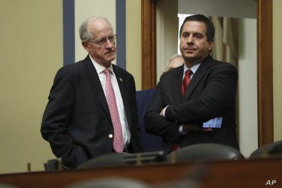 Ranking member Rep. Devin Nunes, R-Calif., talks to Rep. Mike Conaway, R-Texas, after acting Director of National Intelligence Joseph Maguire testified before the House Intelligence Committee on Capitol Hill in Washington, Sept. 26, 2019.