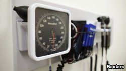 FILE - Medical equipment on the wall of an examination room in San Diego, Calif., Nov. 17, 2014.