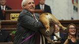 West Virginia Gov. Justice holds up dog during speech, suggests Bette Midler, 'Kiss her heinie'
