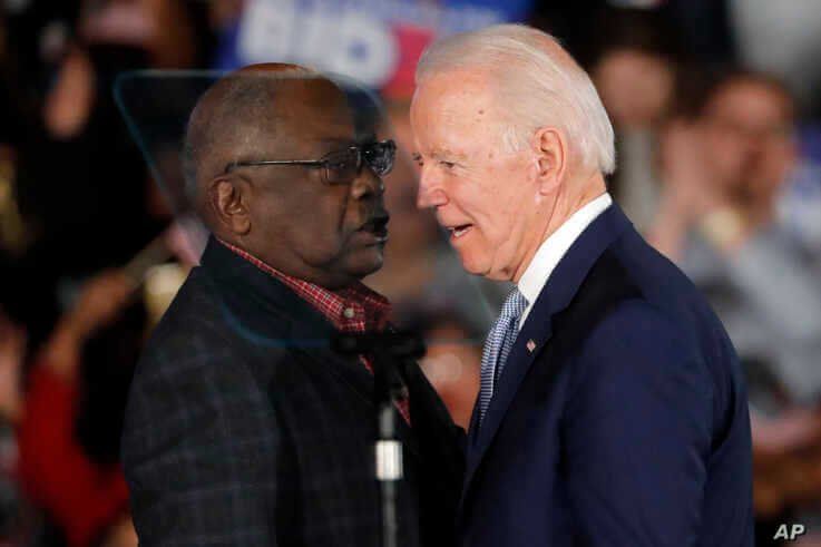 Democratic presidential candidate former Vice President Joe Biden talks to Rep. James Clyburn, D-S.C., at a primary night…
